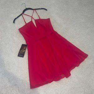 BEBE CROSS FRONT GGT SKATER DRESS